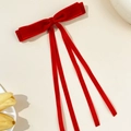 Detail view of red velvet double layer bow hairpin with long flowing ribbons - Red