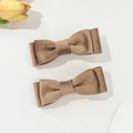 Detail view of brown corduroy bow hair clips showing textured fabric and vintage style - Khaki