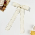 Elegant off-white lace bow hair clip with vintage ribbons and delicate floral patterns - Beige