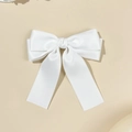 Detail view of a white satin double-layered bow hair clip with long elegant ribbons - White