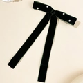 Detail of dark green velvet bow hair clip with white pearls and long ribbon streamers - Dark Green