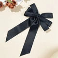 Detail of elegant black satin bow hair clip with long ribbons and a silk-like glossy finish - Double Layer Bow Streamer Style / Black