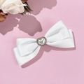 Elegant white satin bow hair clip with heart pearl and rhinestones on pink background - White