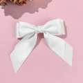 Elegant white double-layered satin bow hair clip with long ribbons on pink background - White