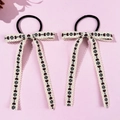 Close-up of heart embroidered ribbons with lace trim on sweet ballet style hair ties - Style 3 Coffee Heart Clover