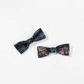Detailed view of two denim bow hair clips with rose gold sequins on a plain white background - Style 2 (Duckbill Clip)