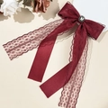 Elegant wine red lace bow hair clip with square rhinestone on a white floral surface - Lace Bow Long Streamer Style / Burgundy