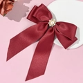 Detail of burgundy satin bow hair clip with vintage pearl and rhinestone centerpiece - Burgundy