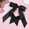 Elegant large black satin bow hair clip with long ribbons on a pink background - Black