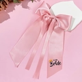 Pink satin bow hair clip with TEAM Bride print for wedding celebrations and parties - Pink