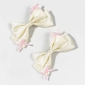 Paar crème satijnen haarclips met kleine roze strikaccenten in een zoete, frisse stijl - Beige