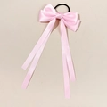 Pink satin bow hair tie with long ribbons and black elastic band on beige background - Pink
