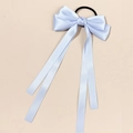 Detail of light blue satin ribbon bow hair tie with long streamers and elastic band - Blue