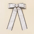 Detail showing long bow hair clip with heart jacquard pattern and black wavy edges - Style 4 / White Heart Jacquard (Black Scallop Edge)