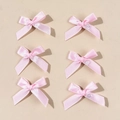 Detail showing six pink satin ballet bow hair clips in a neat 2x3 matrix arrangement - Pink