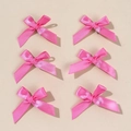 Close-up of 6 pack pink silk satin bow hair clips for women with smooth glossy texture - Rose Red