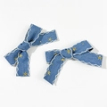 Detail of star embroidery and wavy stitching on a pair of denim bow hair clips - 1# (Pair)