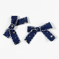 Detailed macro view of denim bow hair clips with gold stars and white embroidery edges - 2# (Pair)