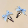 Detail view of light blue satin ribbon bow hair clips on silver metal BB pins - Blue