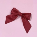 Close-up of a burgundy satin bow tie with fine twill texture for shirts and uniforms - Burgundy