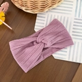 Detail of lavender purple knitted baby headband with twist pattern and center knot - Purple