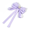 Detail view of lavender satin bow brooch with faux pearl center and long elegant ribbons - Purple