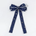 Detail of blue denim bow hair clip with gold stars and white lace scalloped edges - Dark Blue