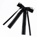 Detailed view of elegant black lace bow hair clip with textured ribbons and fringe tassels - Black