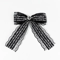 Dettaglio del fermaglio per capelli in pizzo nero con strass a cuore e nastro - Fiocco Pizzo Cuore Strass Nero (1#)