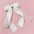 Detail of elegant white double-layered mesh bow hair clip with flowing ribbons - White