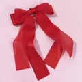 Detail of red double-layer mesh bow hair clip with elegant long ribbons on pink background - Red