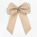 Detail of champagne ribbed grosgrain fabric bow hair clip with elegant long ribbons - Khaki