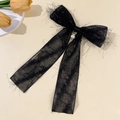 Detail of elegant black mesh bow hair clip with sparkling silver thread and pearl charm - Black Pearl Pendant Style