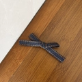 Close-up of denim bow hair clip with orange stitching details on dark wood background - Classic Ribbon Bow / Dark Blue (1#)