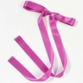 Detail of rose pink satin bow hair clip with long flowing ribbons on white background - Rose Red