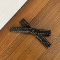 Close-up of a denim bow hair clip with orange stitching on a rustic wooden background - Classic Ribbon Bow / Black (3#)
