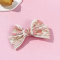 Pince à cheveux nœud vintage avec broderie dorée sur tissu jacquard floral crème - Rose