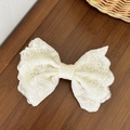 Close-up of a vintage cream lace bow hair clip with floral embroidery on wooden table - Beige Large Embroidered Style (2#)