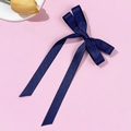 Detailed view of dark blue satin ribbon bow hair clip with elegant long streamers - Navy Blue