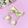 Detail of a yellow satin bow hair clip with green ribbon and tulip floral pendants - 16# Yellow Double Bow (Tulip Pendants)