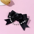 Detail view of black satin bow hair clip with fabric rose and white pearl tassel charms - Black