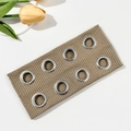 Close-up of khaki ribbed headband with metallic eyelets in a punk hip-hop style - Khaki