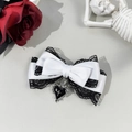 Gothic lace bow hair clip featuring a black heart and silver cross detail close-up - White + Black
