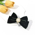 Close-up of dark green velvet bow hair clip with pearl pendant and crystal accents - Dark Green