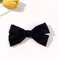 Detail of elegant black satin bow hair clip next to a yellow tulip on white background - Black(5#)