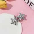 Silver starfish hair clip with metallic texture on pink background with yellow tulips - Silver Textured Starfish (12#)