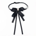 Close-up of black satin bow tie with teardrop faux pearl and rhinestone centerpiece - Elastic Band Style / Black