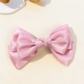 Elegant large pink satin bow hair clip with multi-layered design and glossy silk texture - Pink