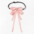 Detail of pink silk bowtie brooch with central pearl and rhinestone embellishments - Elastic Band Style / Pink