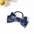 Close-up of blue denim bow hair tie with white floral embroidery and hollow lace edges - Deep Blue Bow Hair Tie (1#)